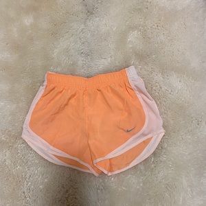 Light orange Nike running shorts